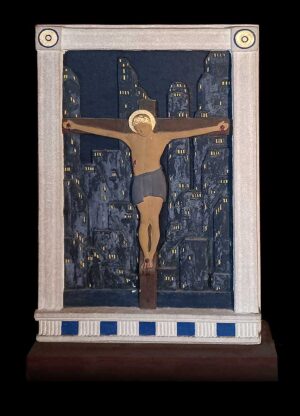 Carved, painted Jesus on the cross superimposed on city at night